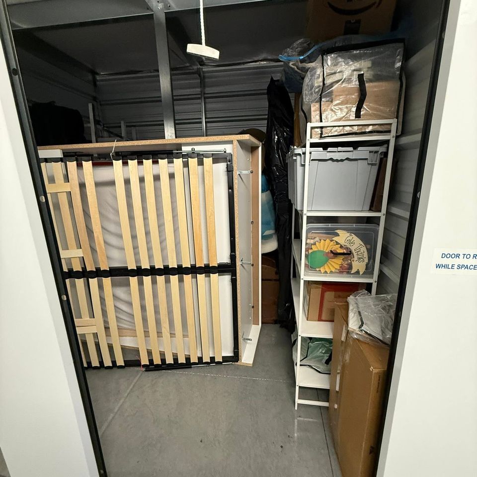 A packed out storage container with junk