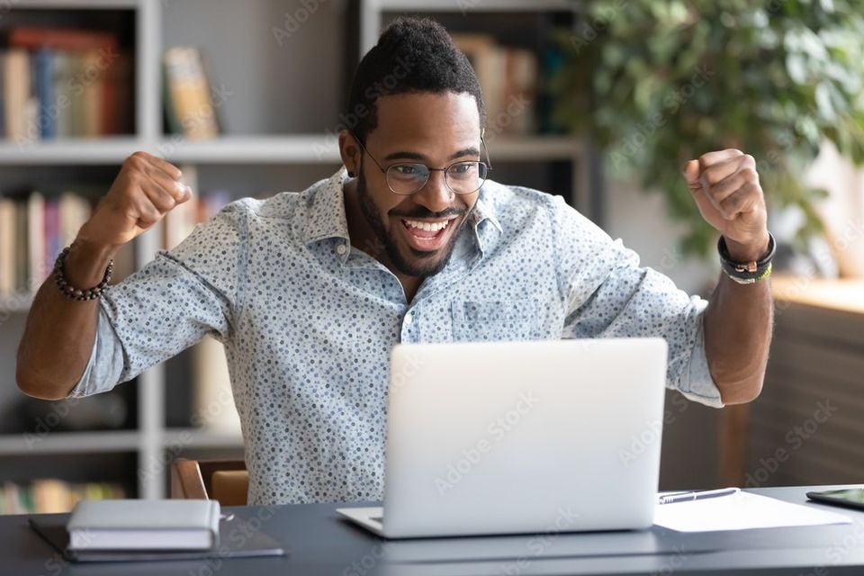 Black man excited about new website desigfn