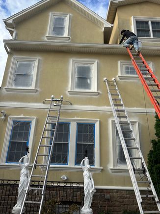 Careful surface prep of a private home before exterior painting