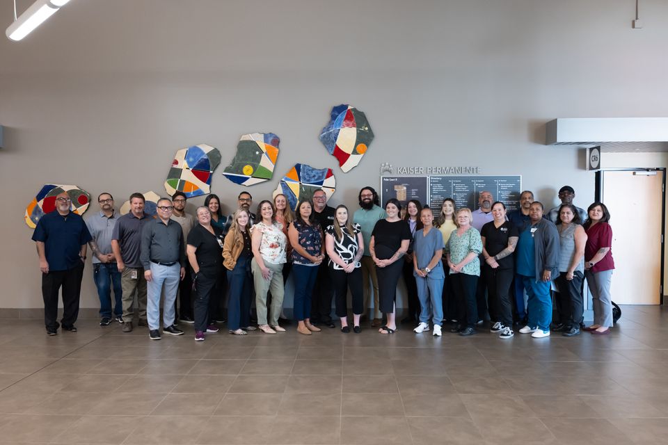 Group shot of people standing in a large room