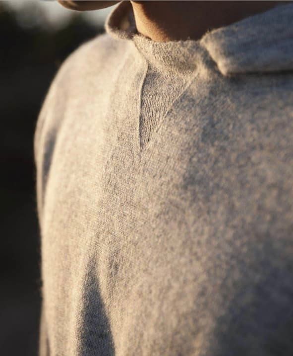 PAKA apparel sweater on a person neck down with great evening light