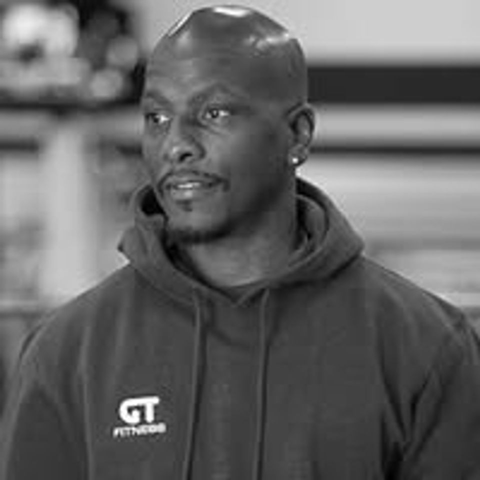 Greg Trent in a GT Fitness hoodie inside a Long Island NY gym