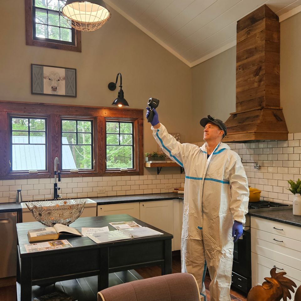 photo of tom hessler performing residential mold test mold testing in raleigh, natural restoration