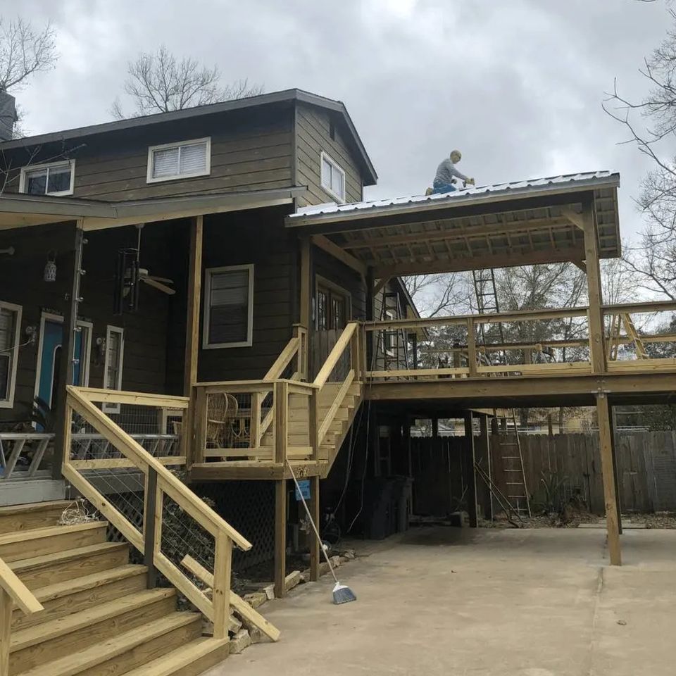 Metal roof installation on a raised deck covered patio built in Spring Texas