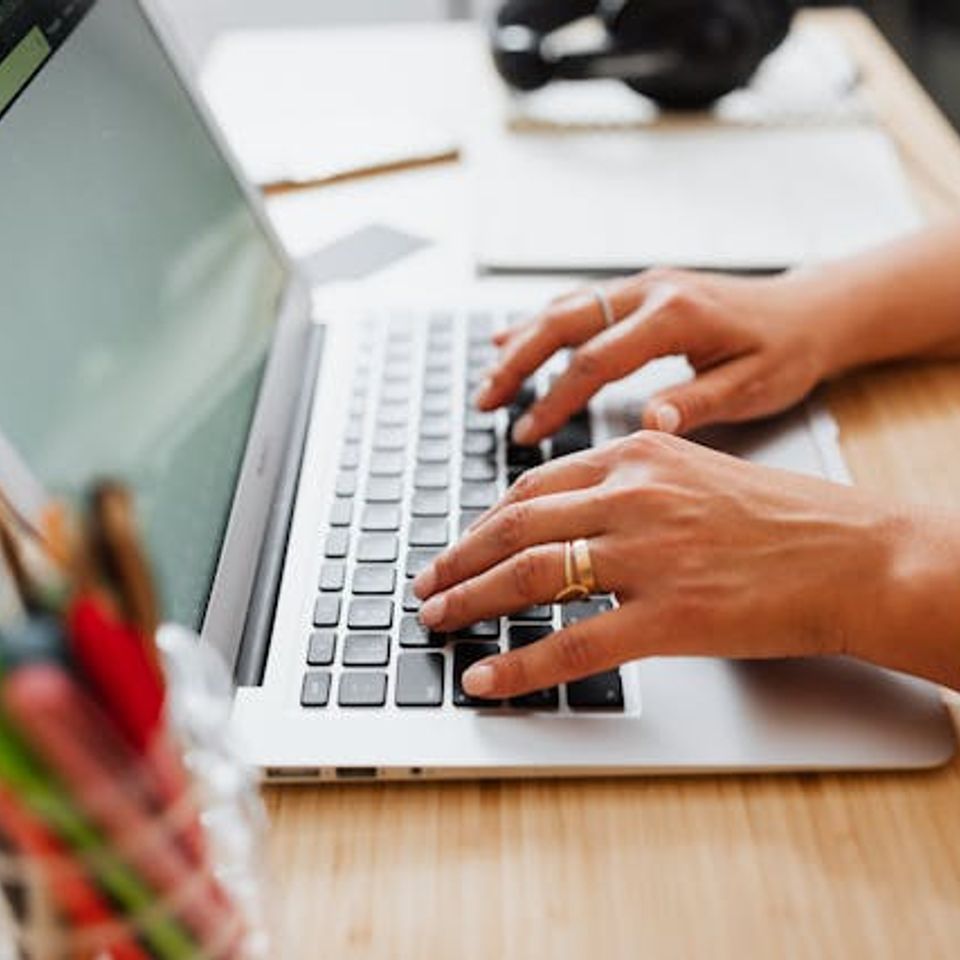 Typing on laptop