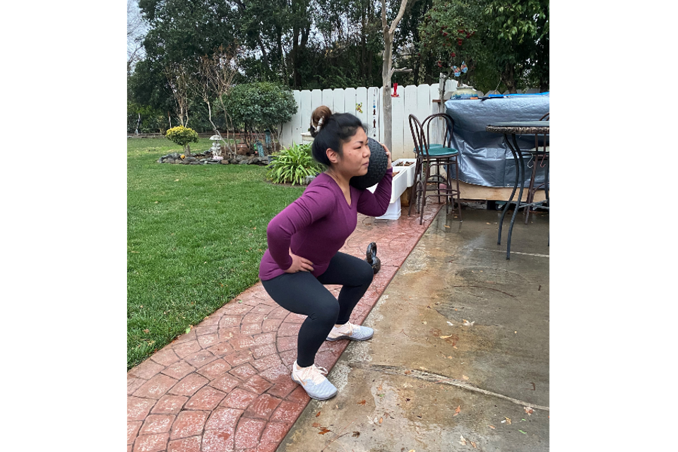 Image of Gym Truck Chico client working out in the convenience of her backyard.
