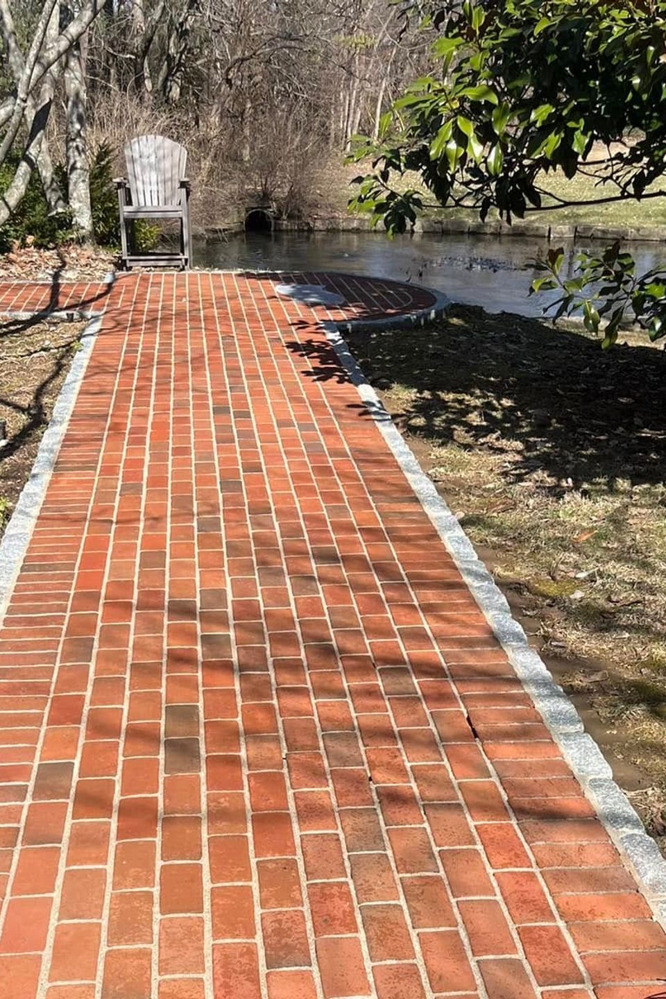 Clean vs dirty brick pathway by TLC Pressure Washing in Louisville.