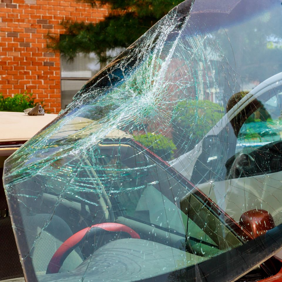 In aftermath an accident near my home, automobile service special workers replaced windscreen