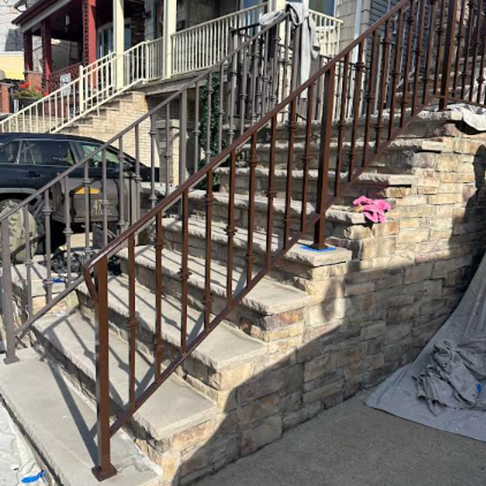 Freshly refinished exterior railing on staircase