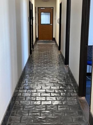 Long office hallway with tile floor