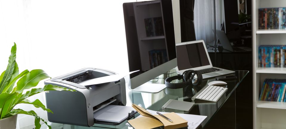 Office with computer glass table