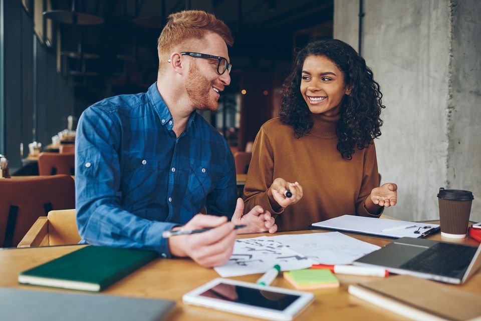 Man and woman talking business