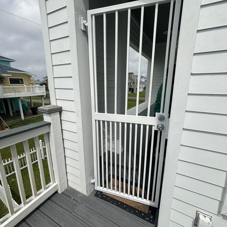 White metal 3*6 walk-through gate fabricated and installed by Marquez Welding in Houston