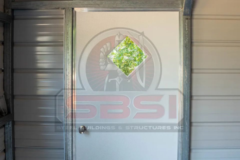 Door inside of a steel building structure, with SBSI watermark representing steel building interiors in Alabama