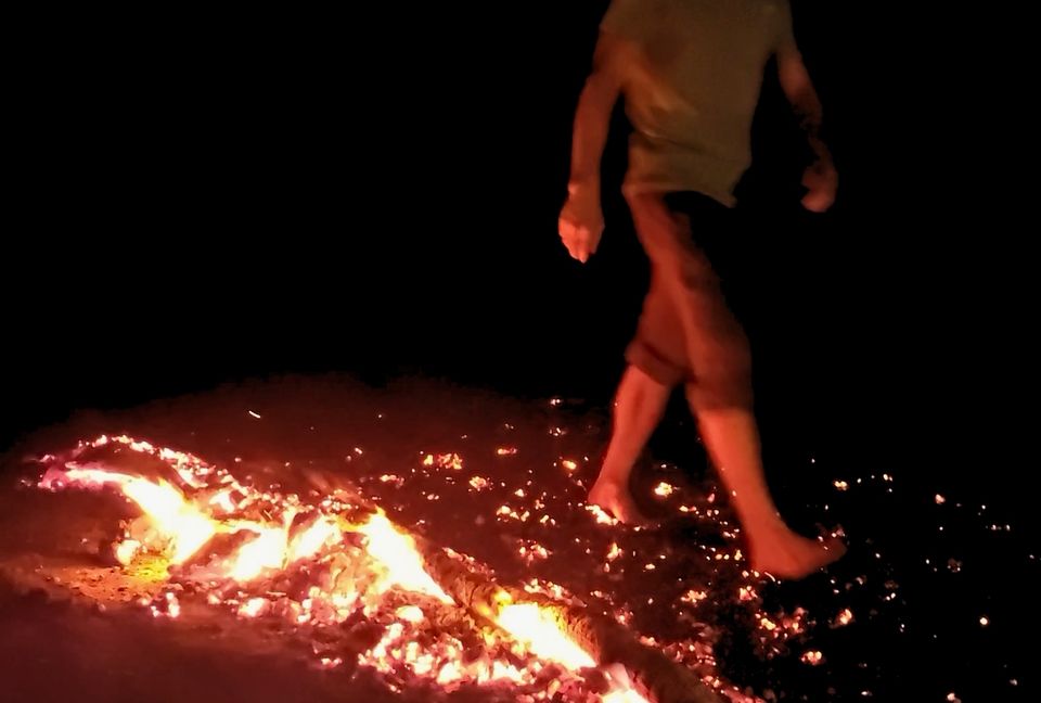 firewalking experience participant walking across hot coals