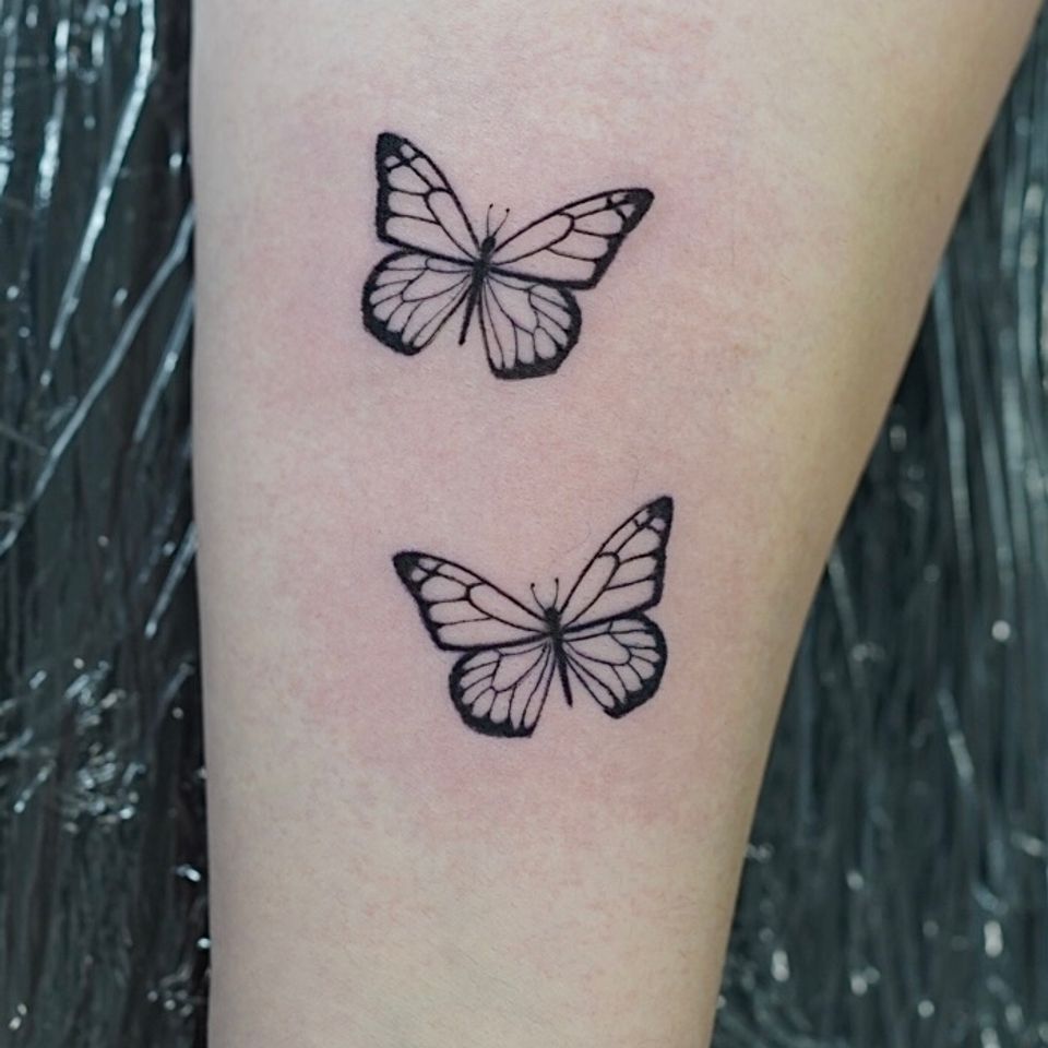 Image of 2 butterflies in black ink and in excellent detail