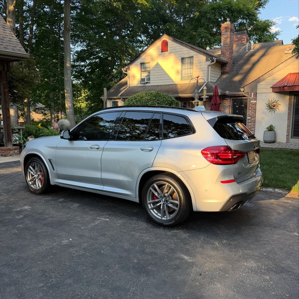 Silver BMW X3 with tinted windows and a clean gloss finish after a mobile exterior detail in Wilmington DE