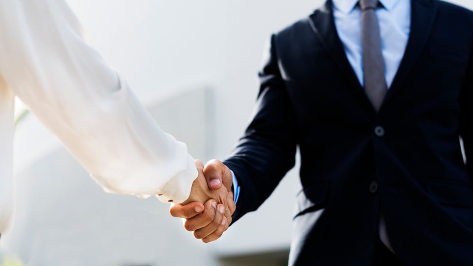 Business people shaking hands for an agreement 2025 02 11 04 34 26 utc