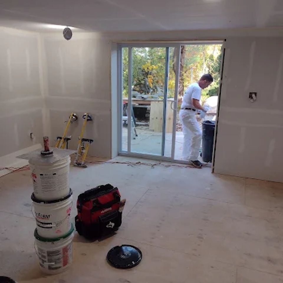 Interior renovation with new drywall and patio door by general contractor in Suffolk County NY
