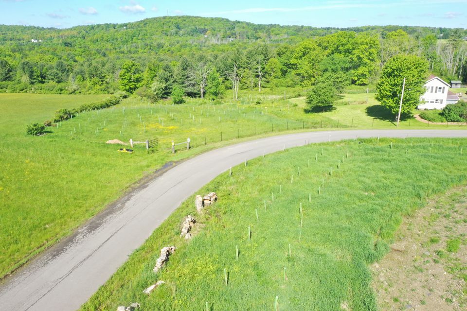 2025 arial drone looking west road and southside of pond