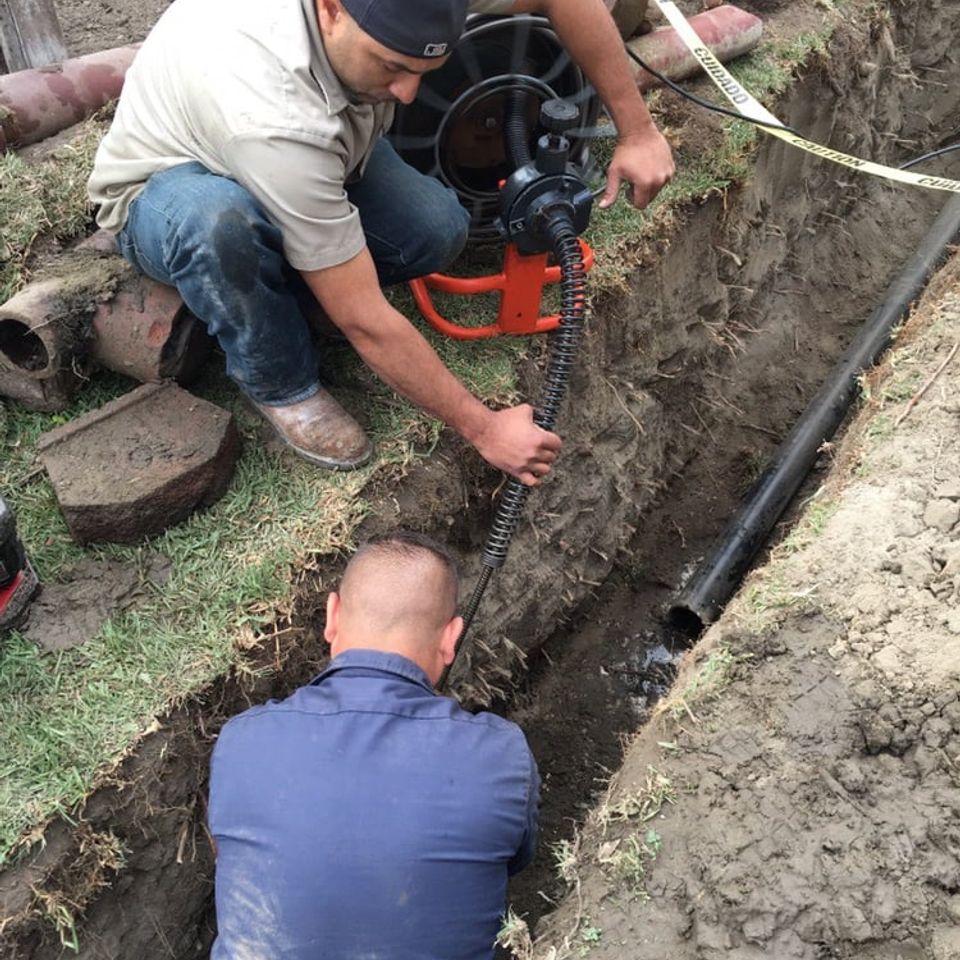 Clearing a sewer line to ensure pipe on city side is clear and in good shape.