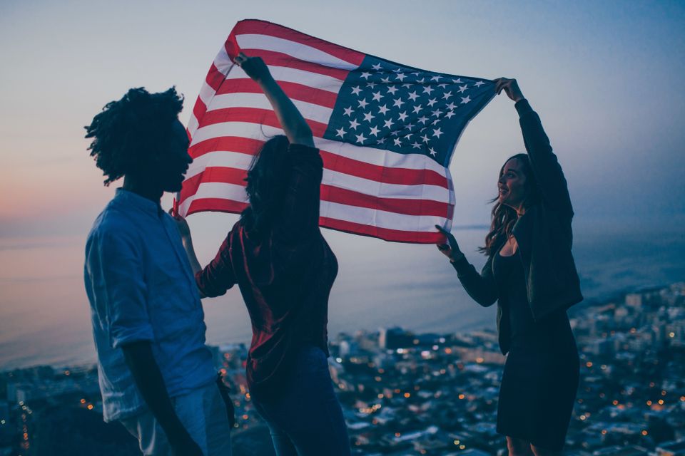 Friends celebrating 4th of july with america flag 2024 10 15 02 12 02 utc (1)