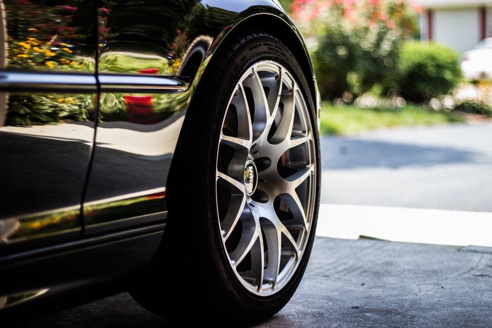 Image of a car and it's passenger side front tire.