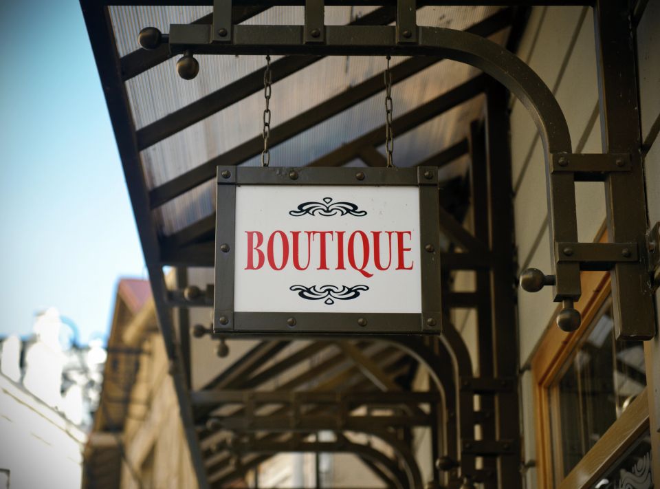 A professionally installed, storefront sign for a local boutique business, used in a blog by Cannone Marketing.