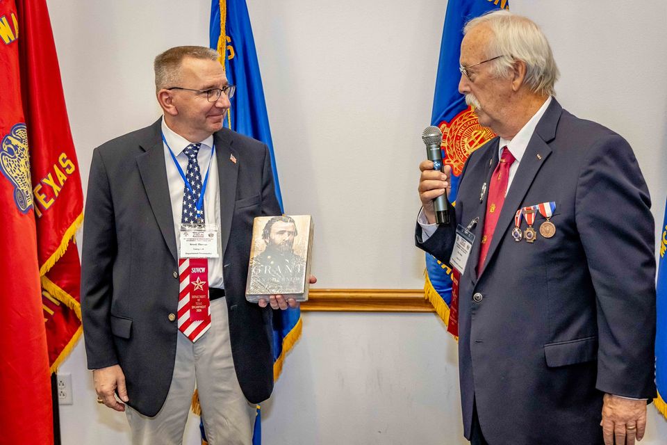 80   pdc thomas receives gift from past secr. gates