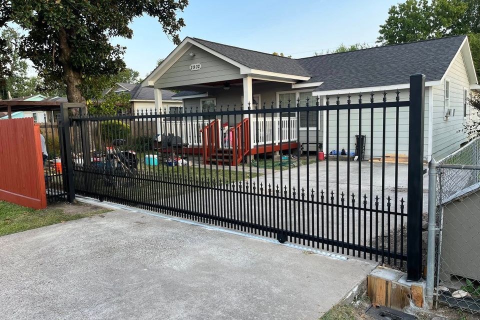 Custom iron driveway gate designed and welded for strength and style. Built in Houston with premium materials for long-lasting performance.