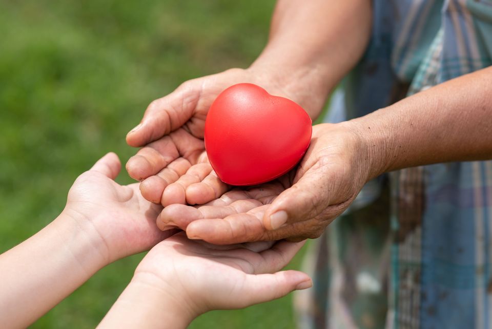 People holding rubber heart