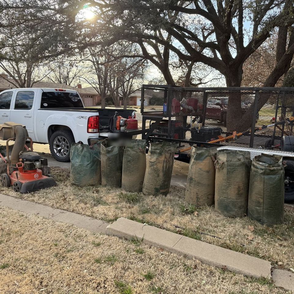 Mowin N Goin truck, trailer and full leaf bags after a fall cleanup