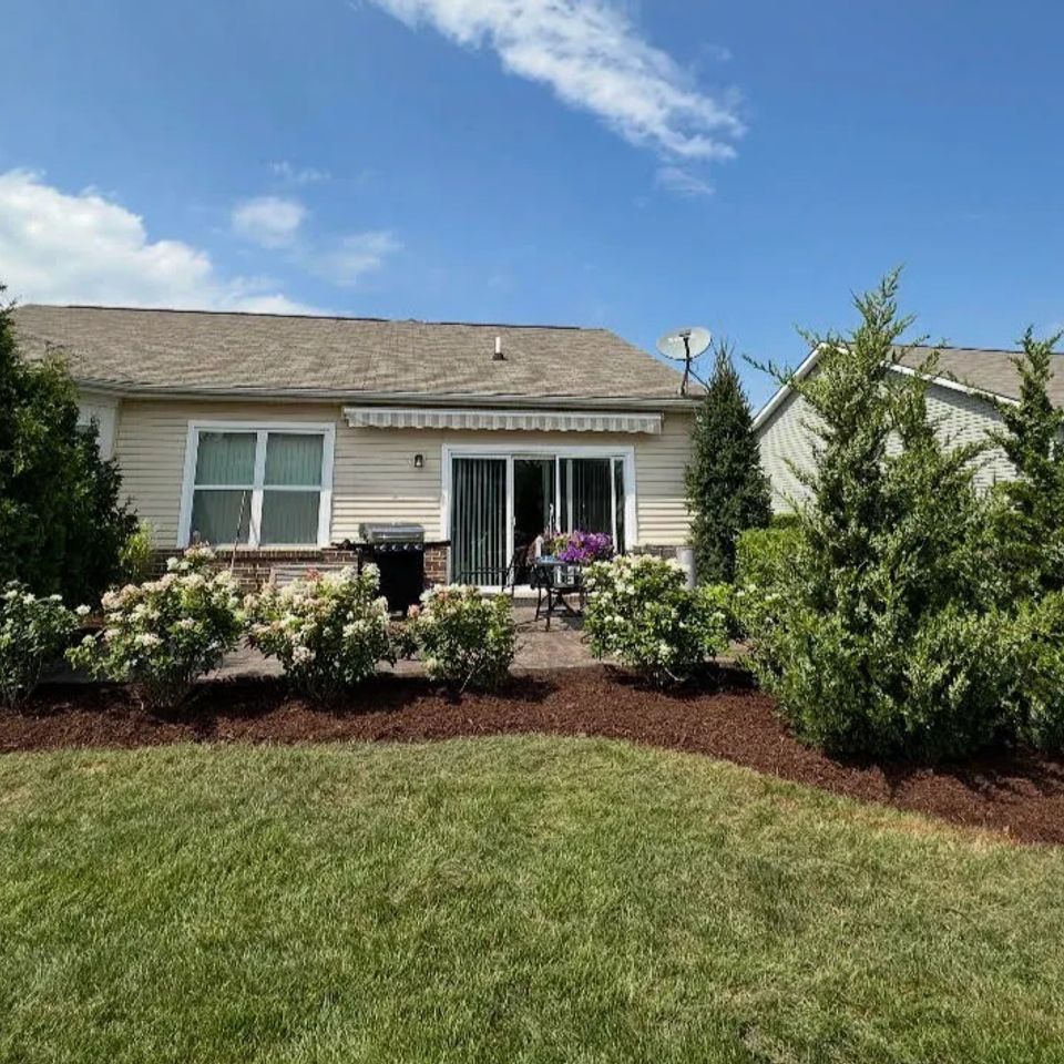 Wide view of a professional mulching job done by Vic's Landscaping of Michigan