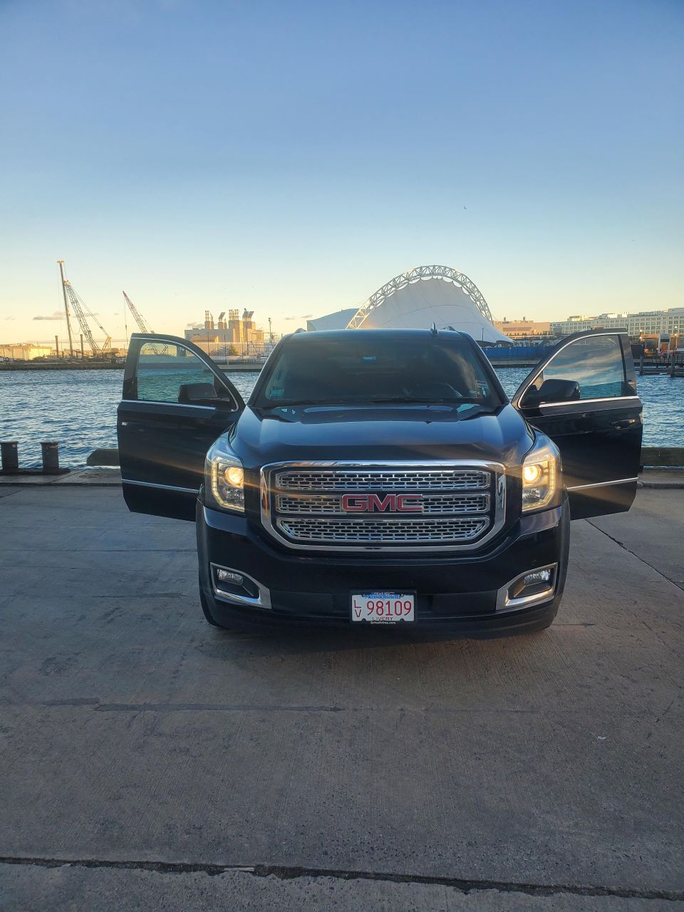 Pinnacle gmc yukon xlstraight on doors open boston backdrop