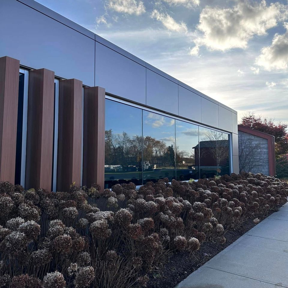 Spotless floor-to-ceiling glass on a modern commercial building after window washing in Tillsonburg Ontario