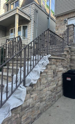 Careful prep of surface before railing repaint in Bayonne, NJ