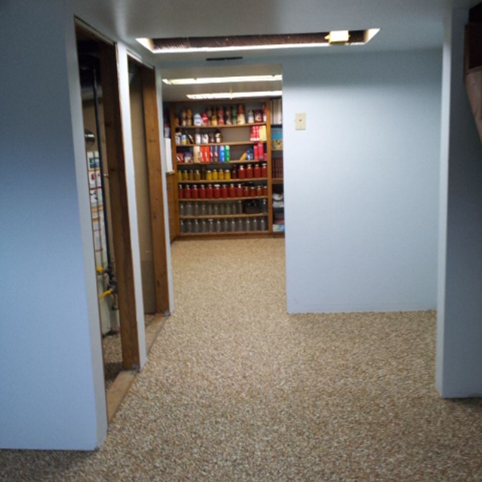 Basement hallway finished with an EverStone decorative stone floor.