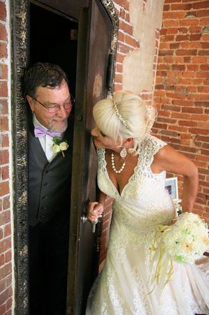 Bride and groom hide and seek in the vault