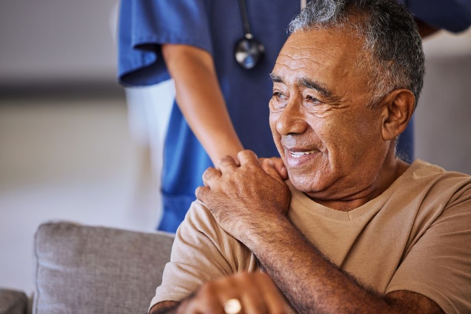 Senior man with caretaker