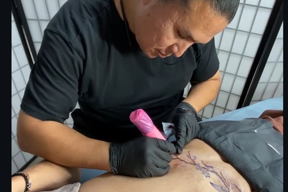 Adrian Anderson Tattoo Artist Creating A Tummy Tuck Tattoo