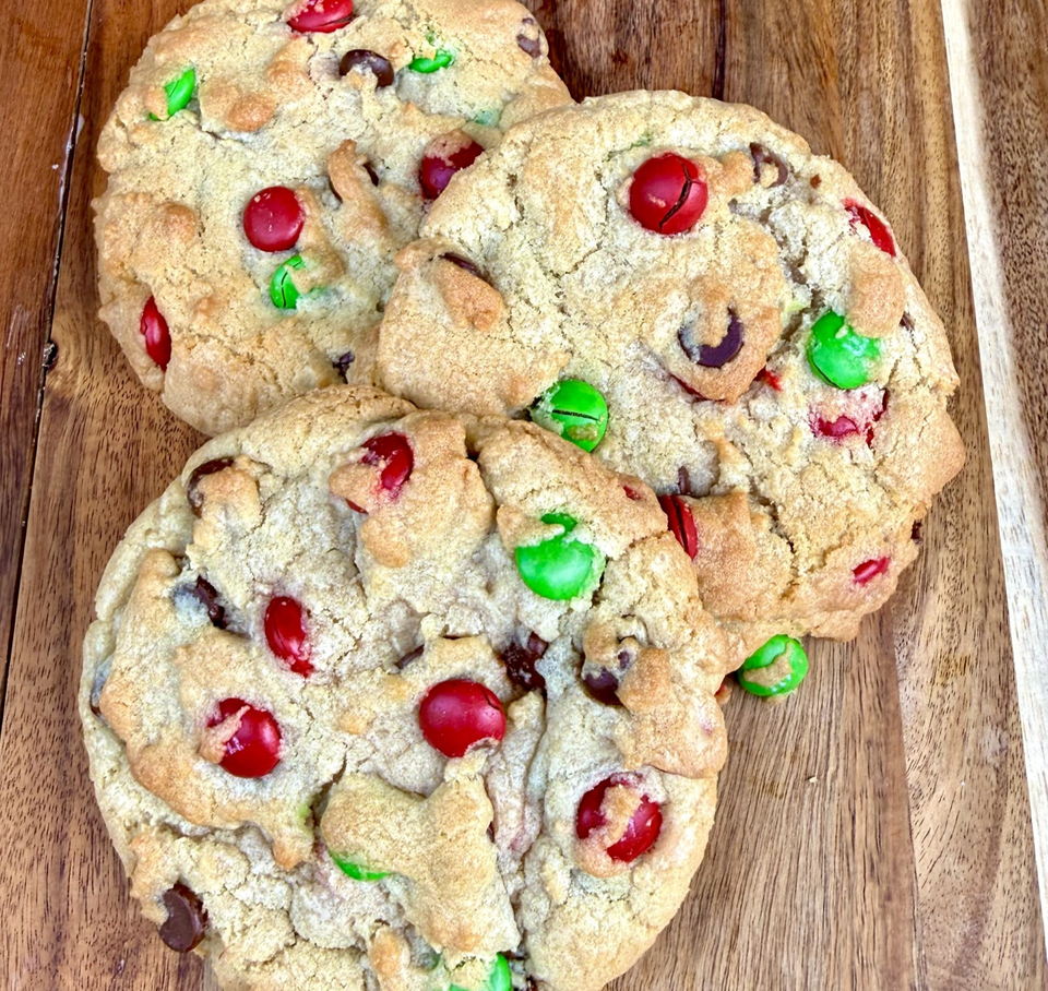Three Christmas M&M Christmas Cookies with red and green M&M's.