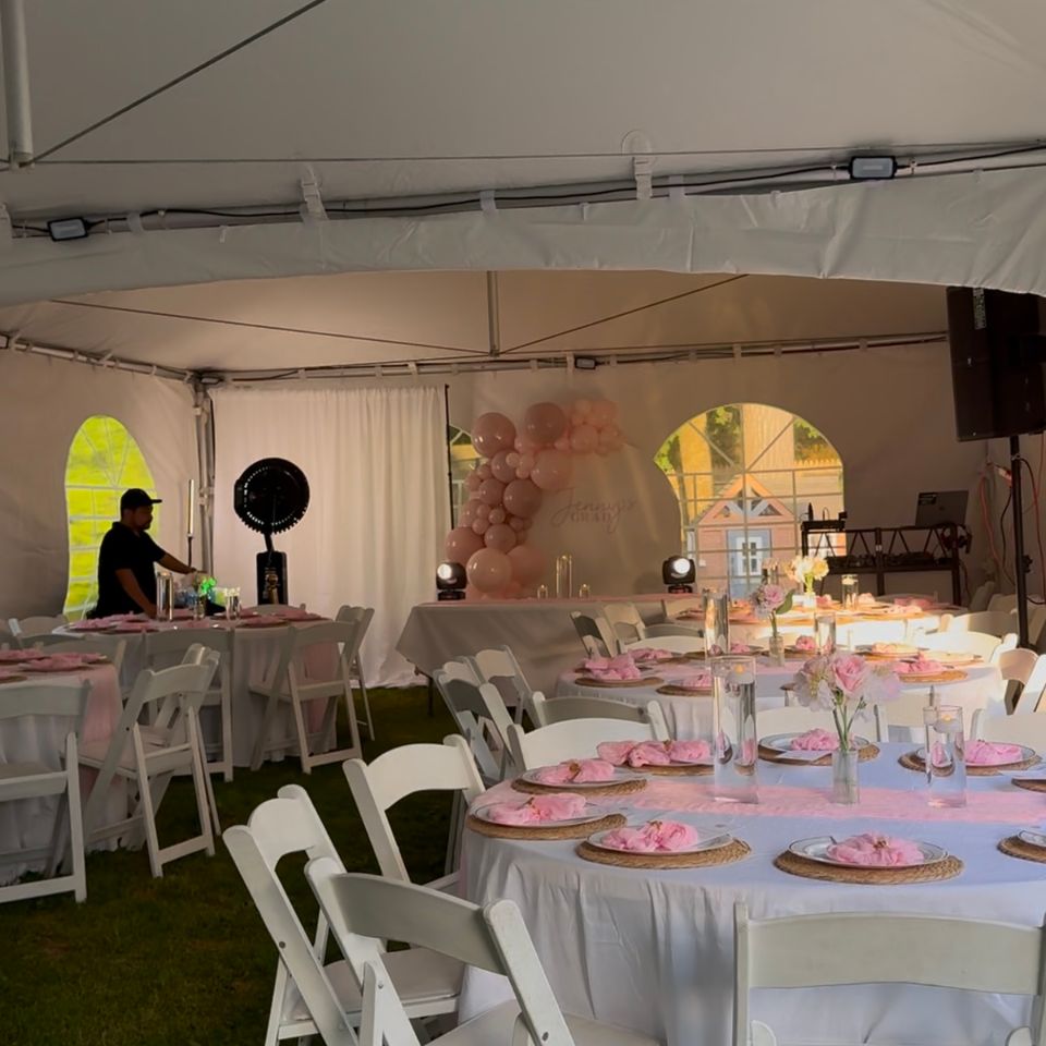Tented graduation party with pink table styling and blush balloon decor backdrop in the Hamptons NY