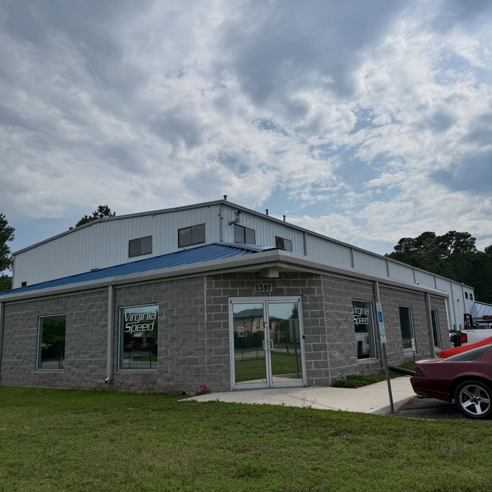 Virginia Speed shop exterior with tinted storefront windows and glass entry doors