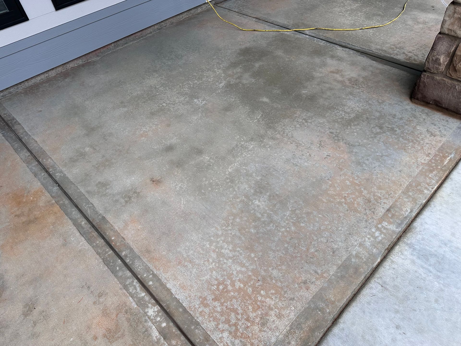 Before photo of porch concrete near home exterior before decorative concrete overlay