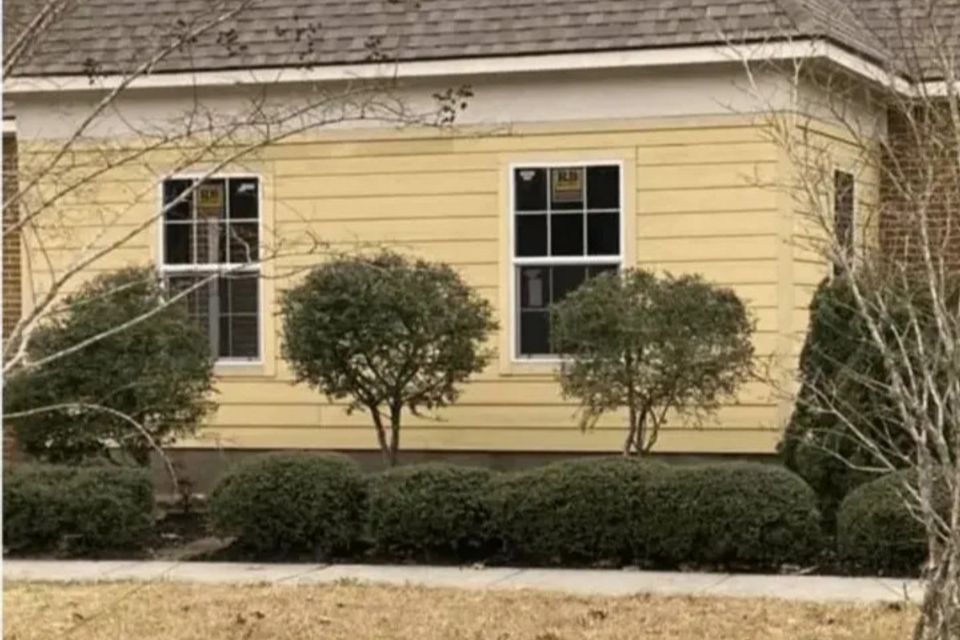 Completed enclosed porch addition with new siding and windows