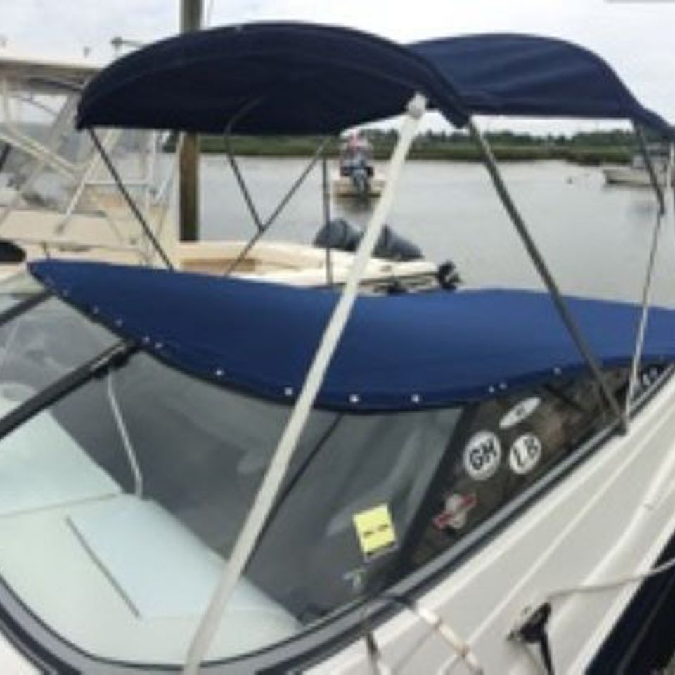 Speedboat canvas snap cover view from front starboard side showing most of boat 2