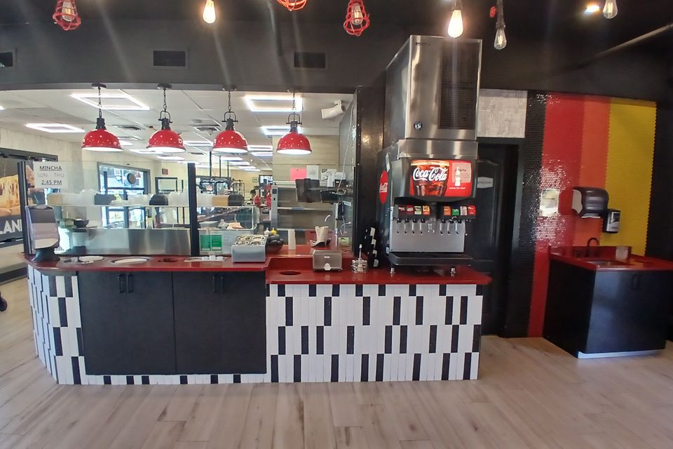 Custom cabinetry for pizza shop display designed by Ultimate Kitchens.