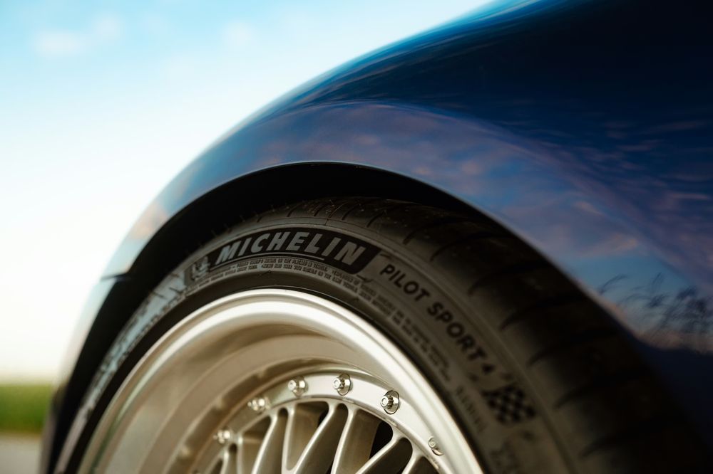 Newly installed tire on SUV after replacement service in a professional auto repair shop