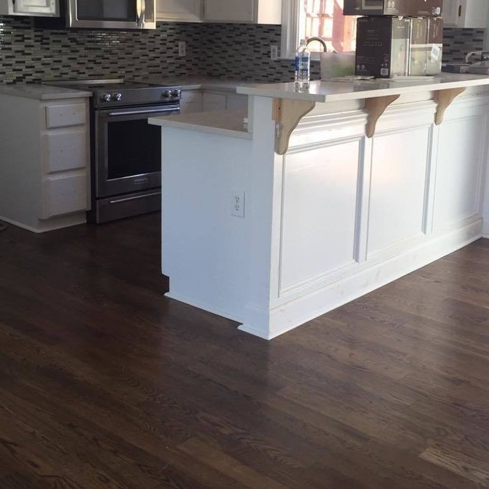 Residential laminate flooring installed in a Raleigh's home kitchen.