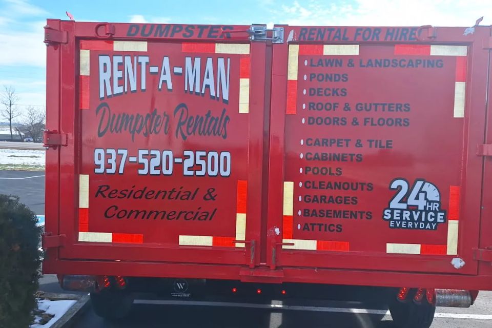 Back of Rent-A-Man Dumpster Rentals dumpster featuring company branding, contact information, and service details.